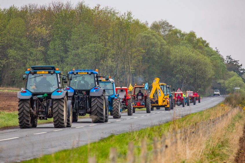 Convoy of tractors in rural Angus.