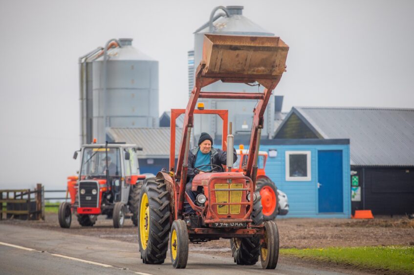 Vintage tractors take part in Angus charity run.