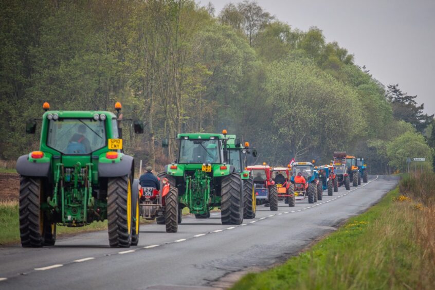 Tractors on a charity run through Angus.