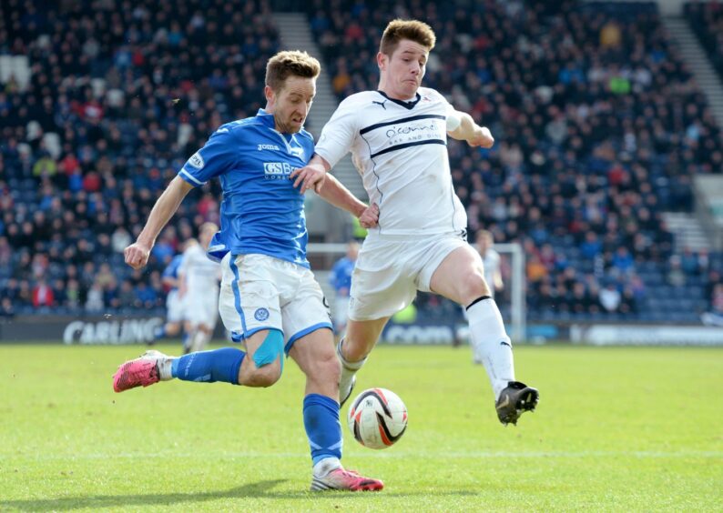 St Johnstone striker Steven MacLean and Raith Rovers defender Dougie Hill battle for the ball in a Scottish Cup tie in 2014.