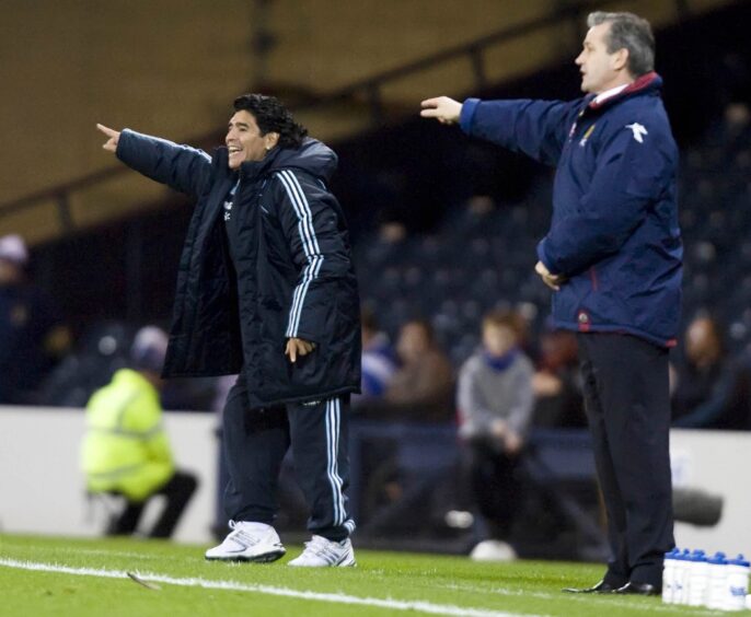 Diego Maradona and George Burley on the sidelines at Hampden in 2008.