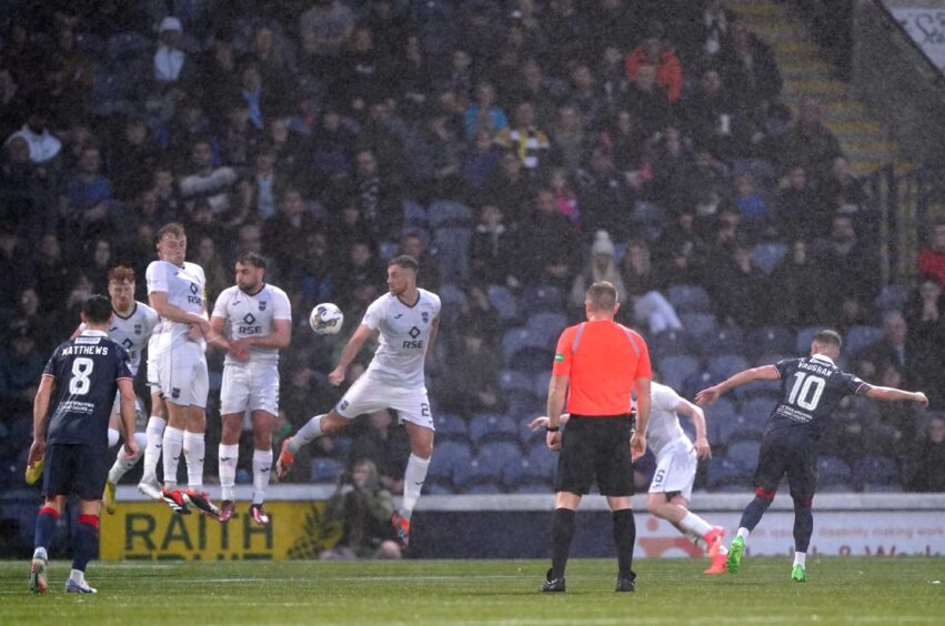 Lewis Vaughan's first-half free-kick for Raith Rovers hits the Ross County wall.