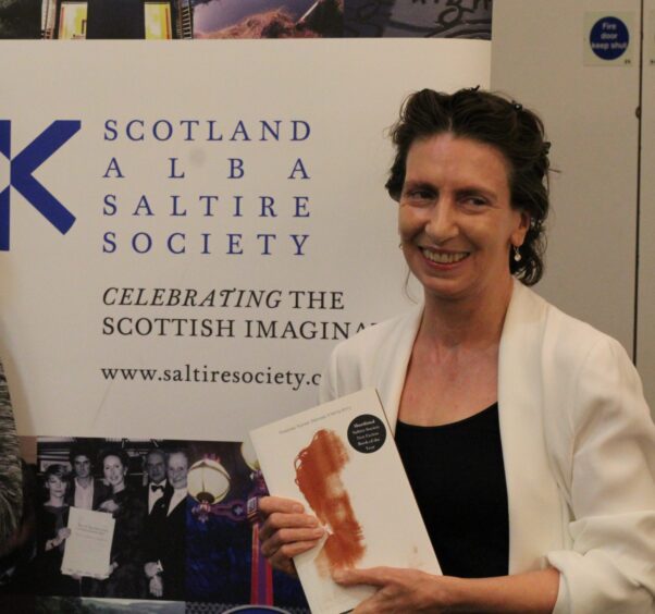  Gill, from Perthshire, pictured with the copy of her memoir.