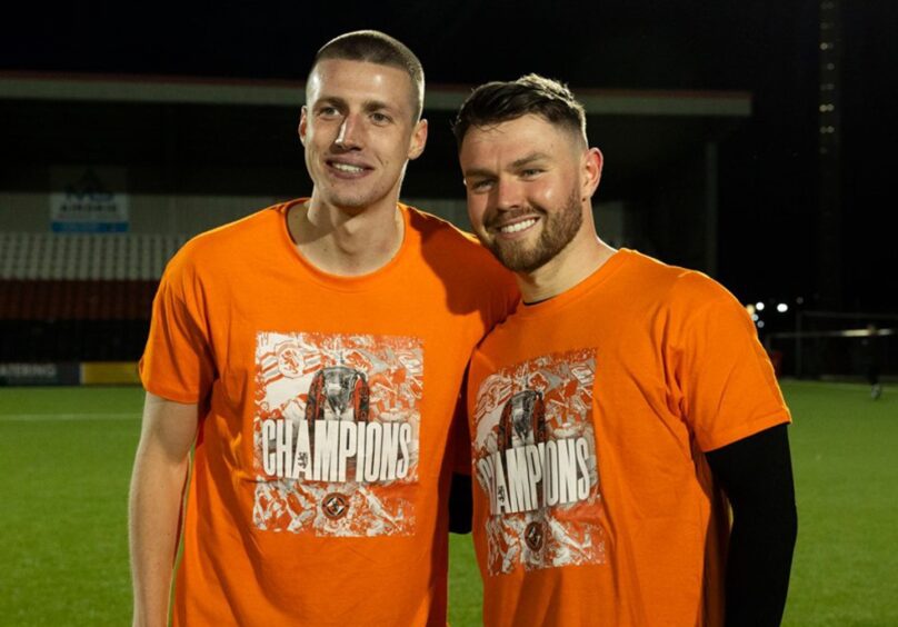 Sam McClelland, left, and fellow title winner Glenn Middleton on the night United officially won the league in Airdrie