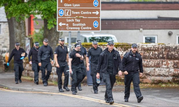 Police activity in Aberfeldy on Friday after police announced a man had been arrested in the Brian Low shooting probe. Image: Steve Brown/DC Thomson