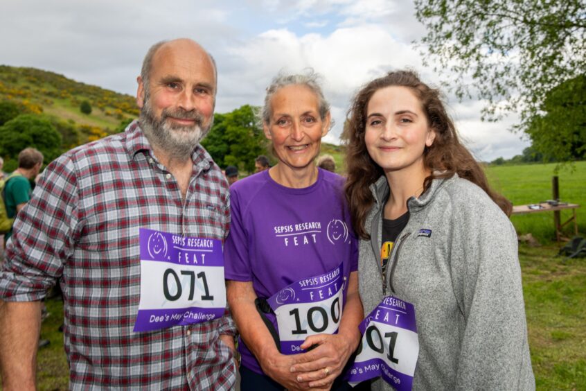 Ian Thomas, Dee Thomas and Jasmine Thomas in front of hill at Comrie