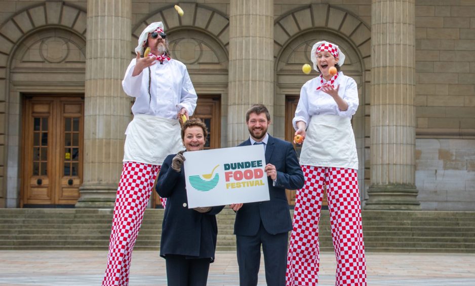 Councillors Heather Anderson and Steven Rome were accompanied by juggling stilt walkers from Showboat Circus as they reveal the line-up for the Dundee Food and Drink Festival.