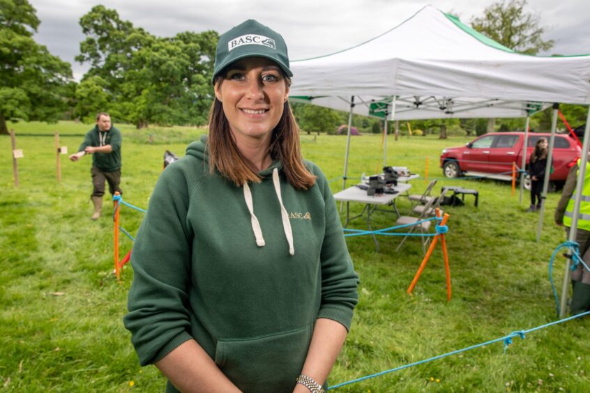 Lianne MacLennan in green BASC Scotland sweatshirt and cap