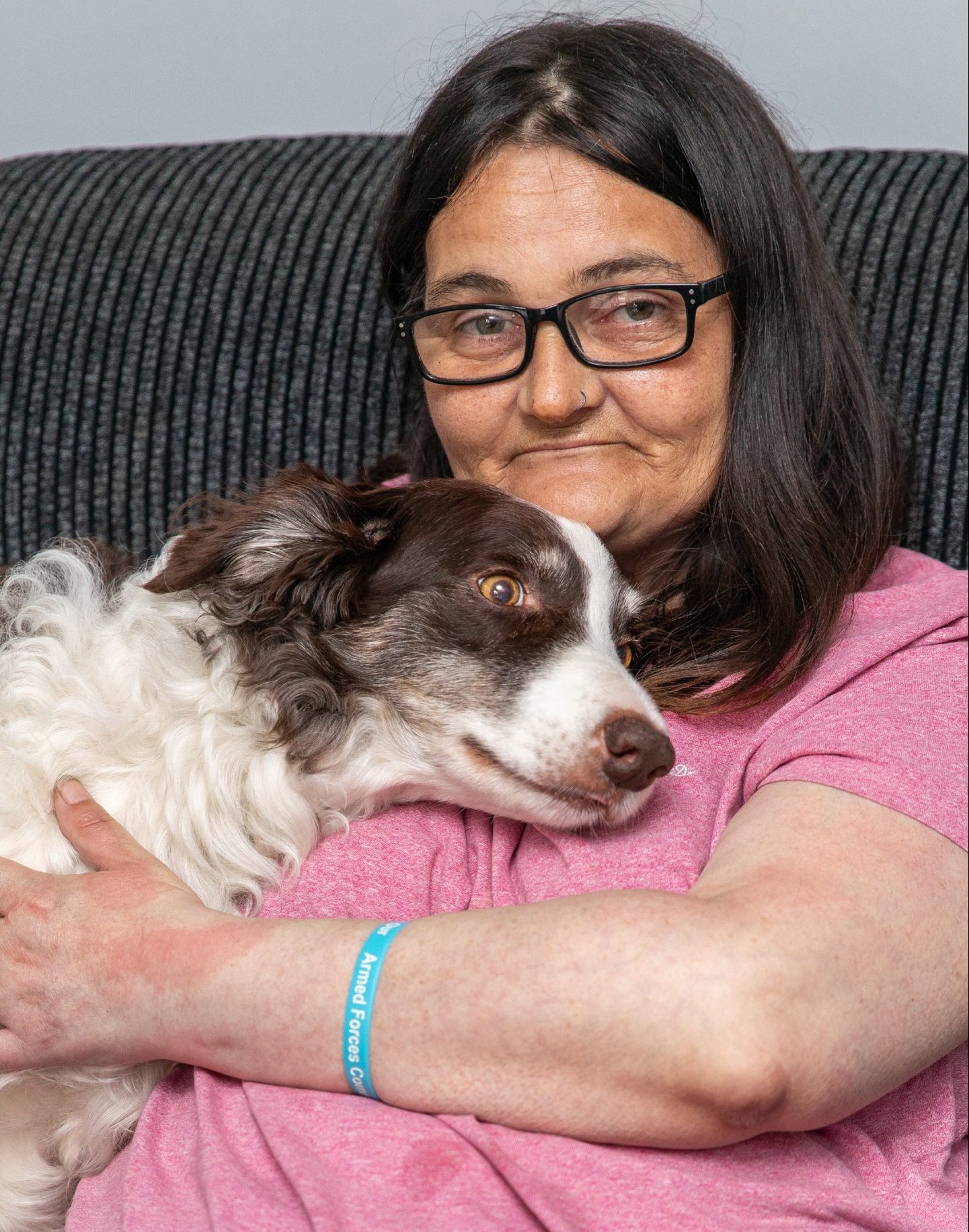 Gemma Ellis, with therapy dog Clova, who helps calm her down.