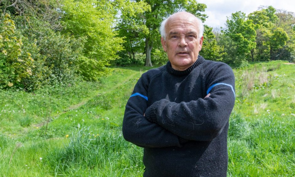 Rod Stoddart, who wants to find assisted living support for his daughter Gemma, standing in a field.