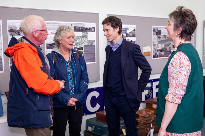 Rory Stewart speaking to two people in Crieff Museum