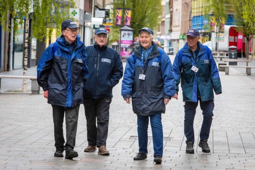 (From left) Street Pastors Sandy Gunn, Michael Archibald, Margaret Baird and Gordon Loudon on Perth High Street.