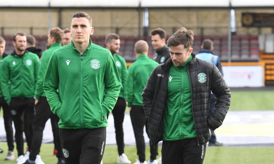 Hibernian duo Paul Hanlon and Lewis Stevenson in their track suits ahead of a game.