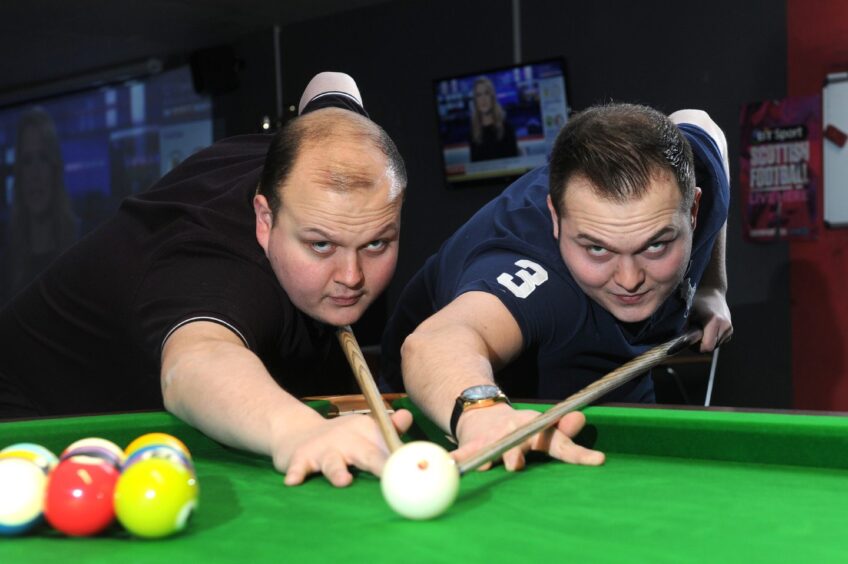 Ryan and Marc Fleming, who brought The Rocket back to Shotz in 2019, pose beside a snooker table