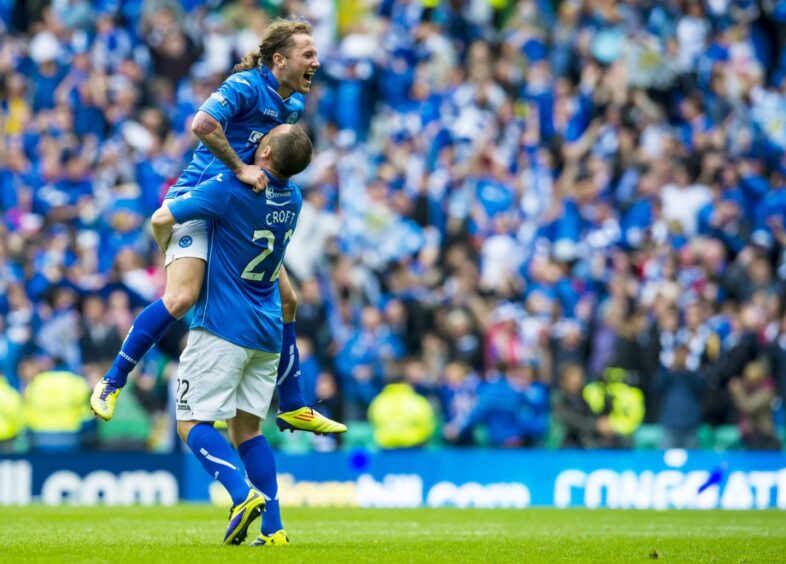 Lee Croft picks up Stevie May after St Johnstone had won the Scottish Cup. 