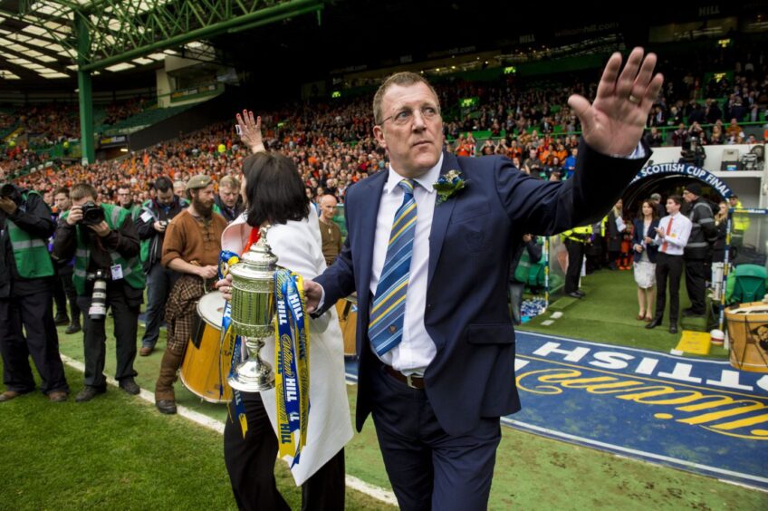 Club legend, Roddy Grant brought the Scottish Cup trophy on to the Celtic Park pitch with Amanda Kopel. 