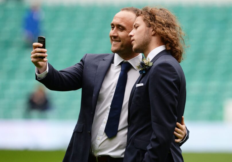 Lee Croft and Stevie May pose for a selfie after they arrive at the stadium. 