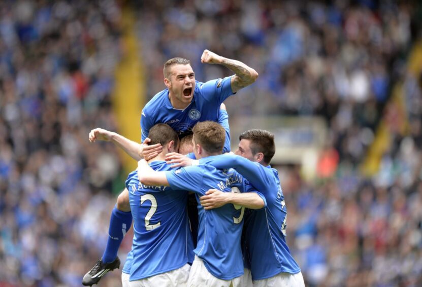 Steven Anderson is mobbed, with loan star James Dunne's passion bursting out. 