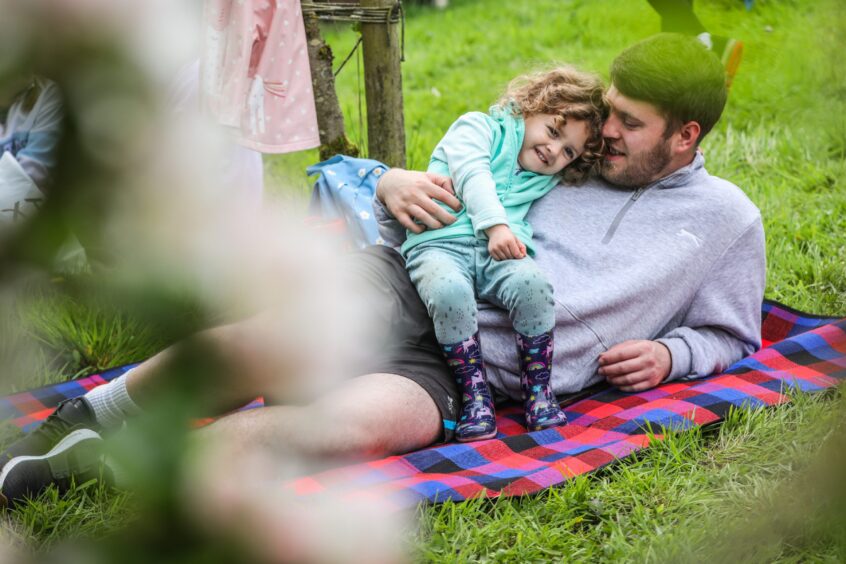 Dad and daughter at Barry Mill family duck racing event.