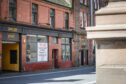 Empty building with To Let sign in window opposite Perth Museum