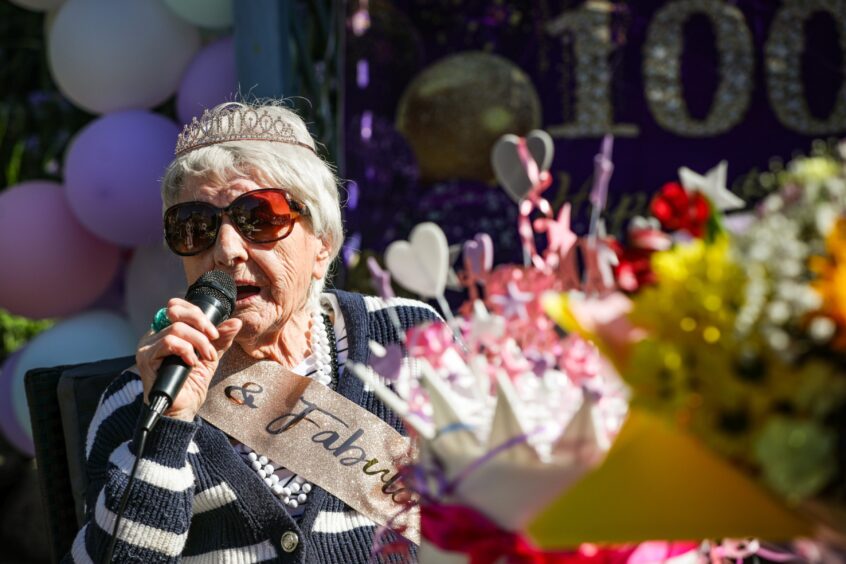 Helen, from Dundee, celebrates her 100th birthday with a song. 