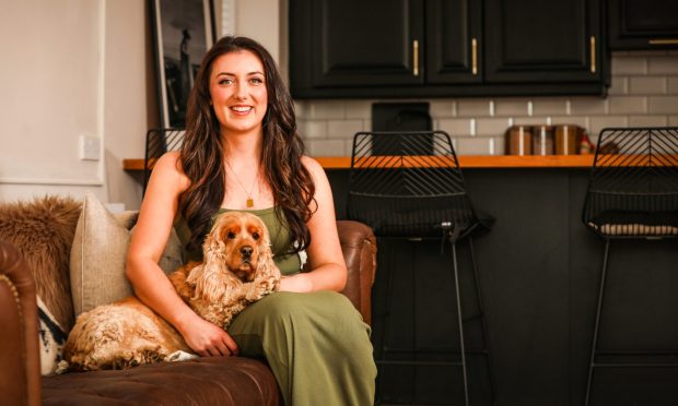 Emilie Gray in her renovated flat with her cocker spaniel Honey. Image: Mhairi Edwards/DC Thomson