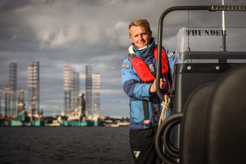 Ian Ashton, owner of SaltDog Marine, on his boat. 
