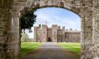 Stone archway with Scone Palace behind