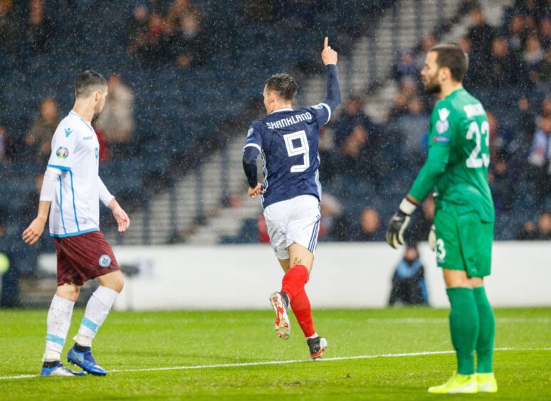 Lawrence Shankland wheels away after opening his Scotland account against San Marino.