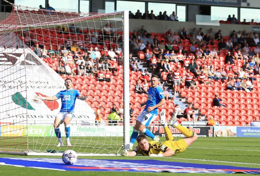 Ian Lawlor saves for Doncaster. Image: Shutterstock