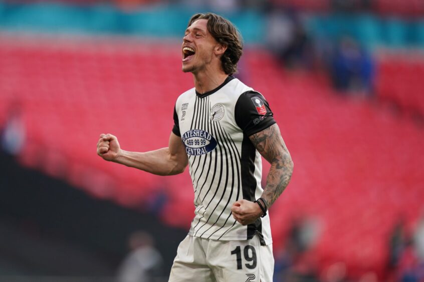 Luke Hannant celebrates at Wembley after Gateshead won the FA Trophy. Image: Shutterstock