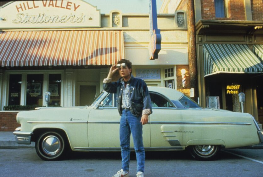 Michael J Fox in jeans and denim in scene from Back to the Future