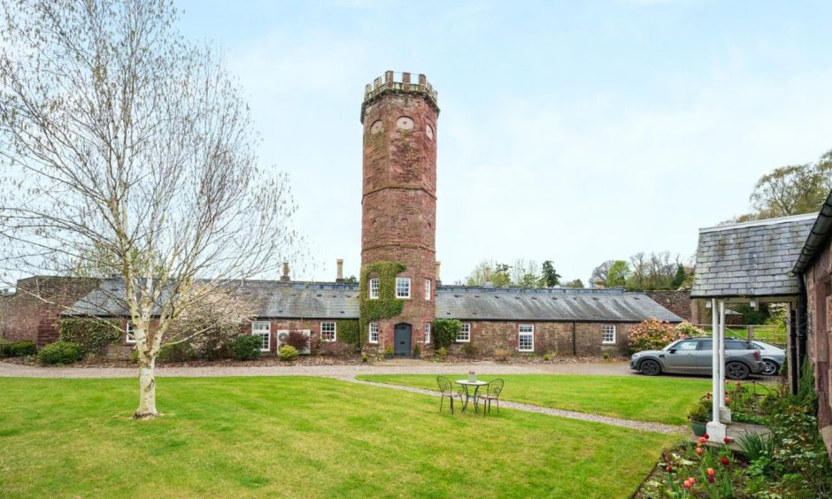 an exterior shot showing the house and cottage