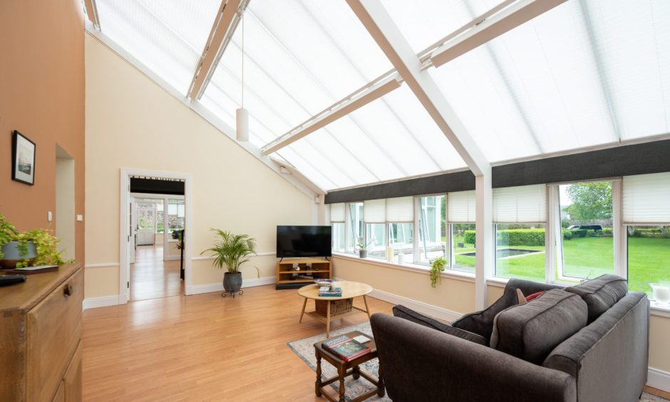 The sitting room, which includes a TV and sofa