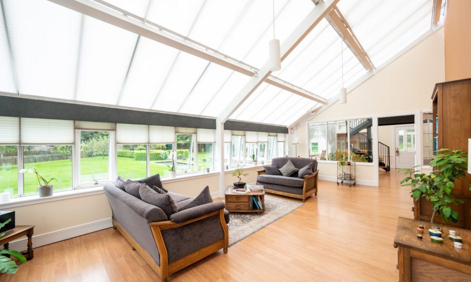 The conservatory sitting room features two sofas