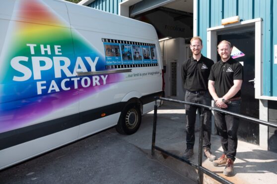 Charlie and Ally Small standing in front of The Spray Factory van