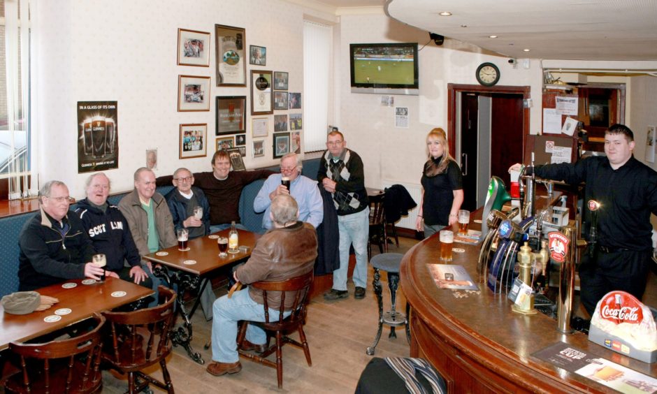 Drinkers sitting near the bar in the Ellenbank Bar in Dundee