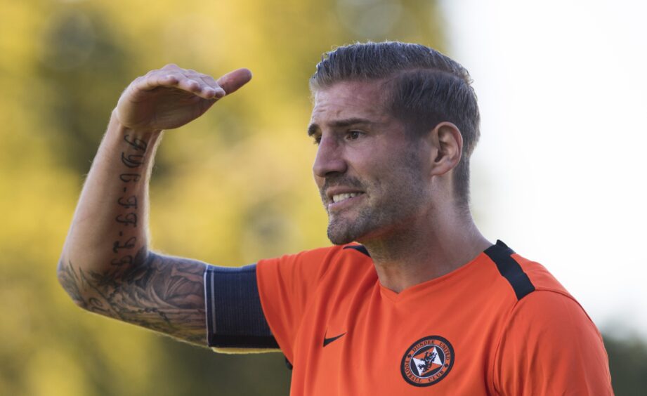 Frederic Frans claims for a high boot during a Dundee United fixture