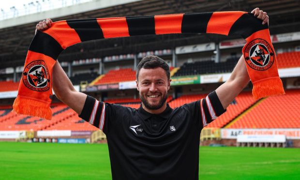 Scarf above the head moment: Dave Richards is unveiled at Tannadice