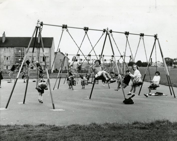 Children on the swings in Douglas playpark in Dundee in 1963.