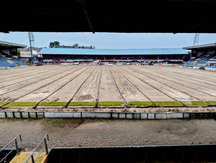 Work going on across the Dens Park pitch. Image: Paul Murray.