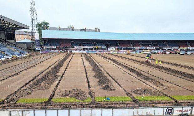 Dundee's Dens Park pitch undergoing major work to fix drainage issues. Image: Paul Murray.