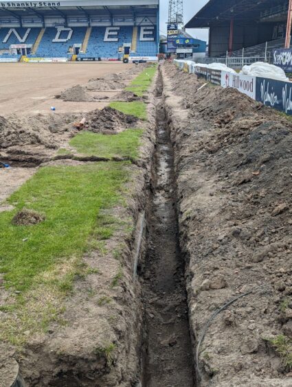 Dundee have had to dig below the undersoil heating. Image: Paul Murray