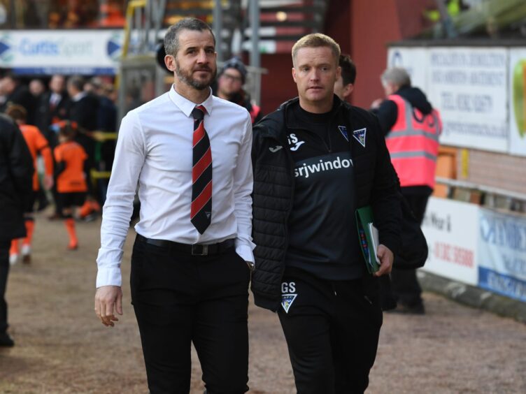 Stevie Crawford and Greg Shields, then Dunfermline manager and assistant) walks down the touchline at Tannadice.