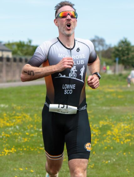 Montrose triathlon runner in 2024 event.