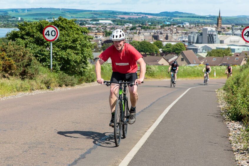 Cyclists on Craig Road in Montrose triathlon.