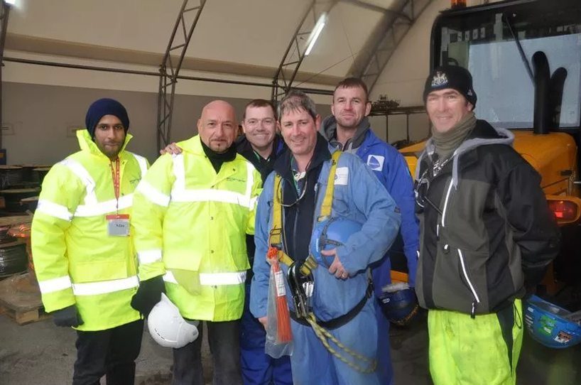Sir Ben Kingsley with workers at the Rosyth shipyard.