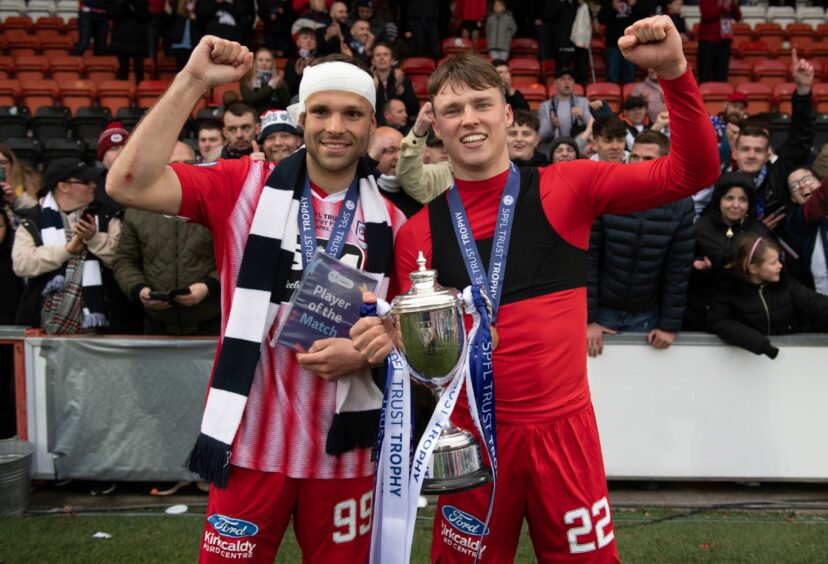 Former Raith Rovers players Ethan Ross and Matej Poplatnik with the Challenge Cup trophy.