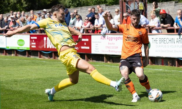 Will Ferry, right, in action for Dundee United