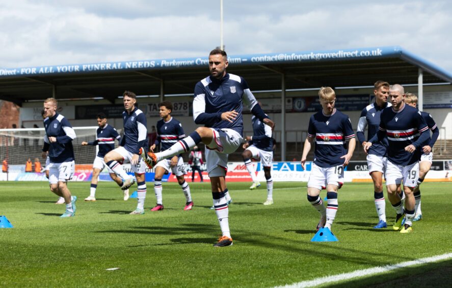 Clark Robertson warms up ahead of his first Dundee appearance. Image: Craig Foy/SNS